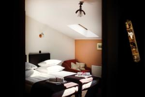 Łóżko lub łóżka w pokoju w obiekcie Hotel Eden