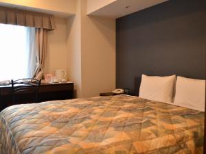 Ένα ή περισσότερα κρεβάτια σε δωμάτιο στο Yokohama Mandarin Hotel