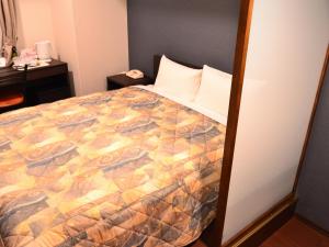 Ένα ή περισσότερα κρεβάτια σε δωμάτιο στο Yokohama Mandarin Hotel
