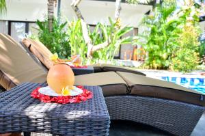 a table with a egg on top of it at Palm Garden Bali in Nusa Dua