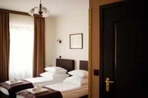 Posteľ alebo postele v izbe v ubytovaní Hotel Eden