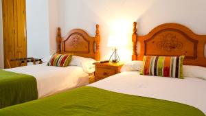 Cama o camas de una habitación en Hostal Restaurante El Mirador