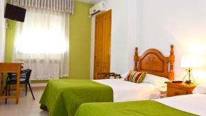 Cama o camas de una habitación en Hostal Restaurante El Mirador