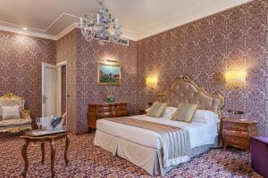 Postel nebo postele na pokoji v ubytování Hotel Ca' dei Conti