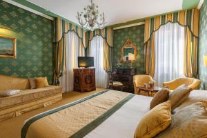 Postel nebo postele na pokoji v ubytování Hotel Ca' dei Conti