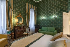 Postel nebo postele na pokoji v ubytování Hotel Ca' dei Conti