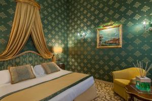Postel nebo postele na pokoji v ubytování Hotel Ca' dei Conti