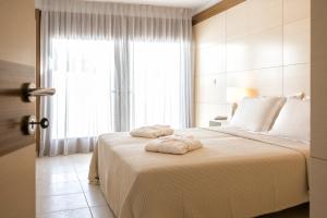 Postel nebo postele na pokoji v ubytování Magdani Private Residences