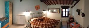 เตียงในห้องที่ Agriturismo Borgo Case Marchi