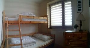 Posteľ alebo postele v izbe v ubytovaní Apartament Akuratny Zakopane