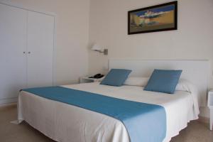 Postel nebo postele na pokoji v ubytování Hotel Sicania