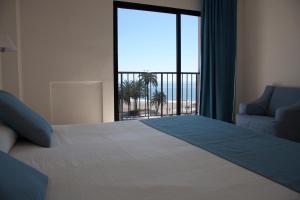 Postel nebo postele na pokoji v ubytování Hotel Sicania