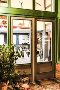 a store front door with a bike in front of it at Pension Alte Scheune in Melsungen