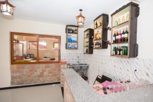 a bar in a restaurant with a counter with drinks at Honey Land Hotel Lalibela in Lalībela