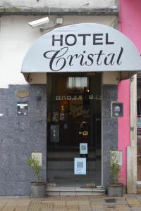 a hotel restaurant with a sign on the front of it at Hotel Cristal in Tandil
