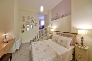 Posteľ alebo postele v izbe v ubytovaní Antouanetta Apartments