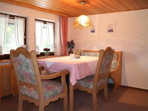 a dining room with a table and two chairs at Haus Schneider in Gutach