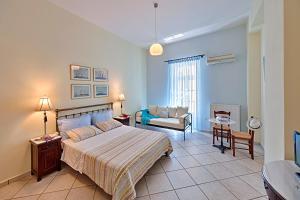 Posteľ alebo postele v izbe v ubytovaní Antouanetta Apartments