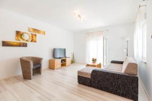 Televízia a/alebo spoločenská miestnosť v ubytovaní Apartment Natalia