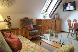 a living room with a couch and a table at Haus Schneider in Gutach