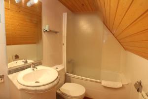 a bathroom with a sink and a toilet and a shower at Casa Rural Hortal in Barruera +21 photos