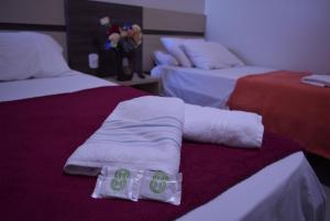 Hotel Sul Real tesisinde bir odada yatak veya yataklar