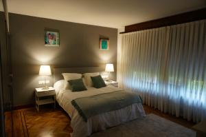 Кровать или кровати в номере Aloka rooms Sopela