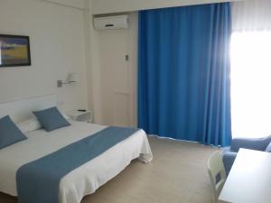 Postel nebo postele na pokoji v ubytování Hotel Sicania