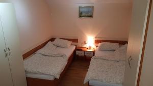 Posteľ alebo postele v izbe v ubytovaní Guest house Kruna