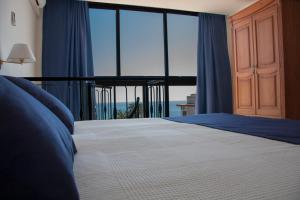 Postel nebo postele na pokoji v ubytování Hotel Sicania