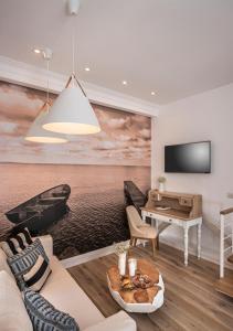 TV a/nebo společenská místnost v ubytování Casa Regina Luxury House