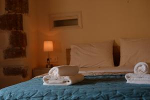 Ліжко або ліжка в номері Fivos Pension