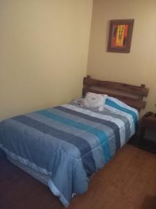 Voodi või voodid majutusasutuse Hostal Cactus Copiapo toas