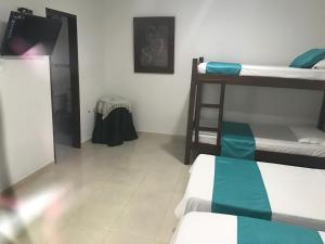 Postel nebo postele na pokoji v ubytování Mayva AprtaHotel