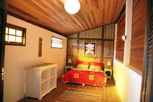 Cama ou camas em um quarto em Chalé na Montanha