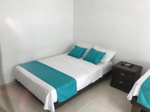 Postel nebo postele na pokoji v ubytování Mayva AprtaHotel