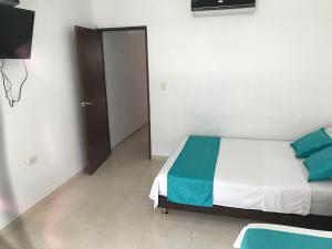 Postel nebo postele na pokoji v ubytování Mayva AprtaHotel