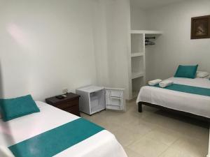 Postel nebo postele na pokoji v ubytování Mayva AprtaHotel