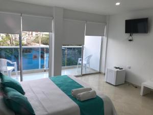 Postel nebo postele na pokoji v ubytování Mayva AprtaHotel
