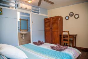 Voodi või voodid majutusasutuse Hotel Brasilito toas