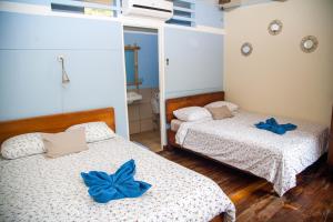 Voodi või voodid majutusasutuse Hotel Brasilito toas