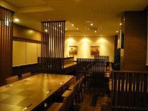 a dining room with a long table and chairs at Hotel Route-Inn Seki in Sekimachi