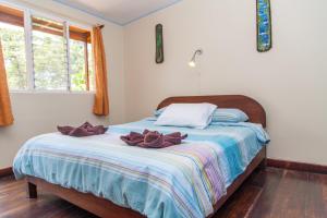 Voodi või voodid majutusasutuse Hotel Brasilito toas