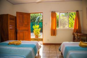 Voodi või voodid majutusasutuse Hotel Brasilito toas