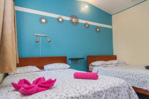 Voodi või voodid majutusasutuse Hotel Brasilito toas