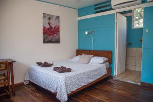 Voodi või voodid majutusasutuse Hotel Brasilito toas