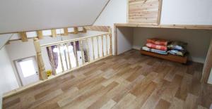 an attic room with a staircase with skis on it at Gyeongju Family Pension in Gyeongju