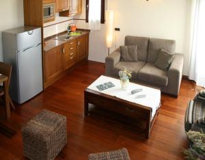 a living room with a couch and a coffee table at Apartamentos Les Picardes in Espot