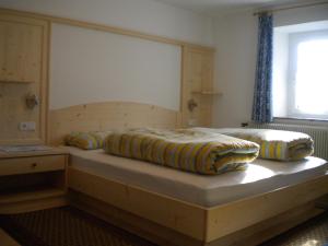 Ліжко або ліжка в номері Gasthof Mittermühl