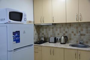 Kuchyň nebo kuchyňský kout v ubytování Old Tbilisi Narikala Apartment + 37 fotografií